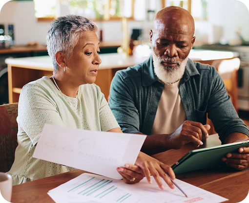An older couple reviewing documents together at home