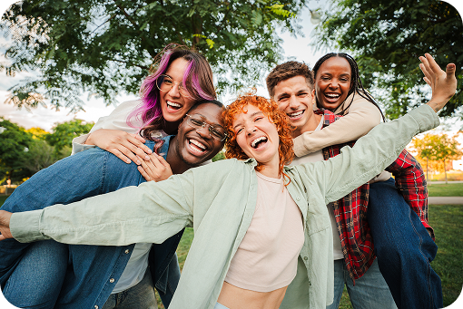 A group of friends laughing together outdoors