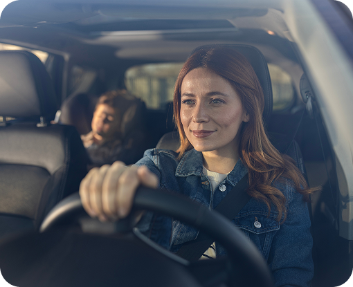 Two people talking in the front seats of a car