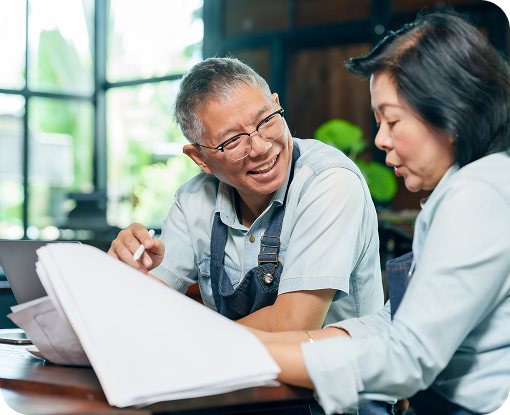 Two business owners reviewing paperwork together