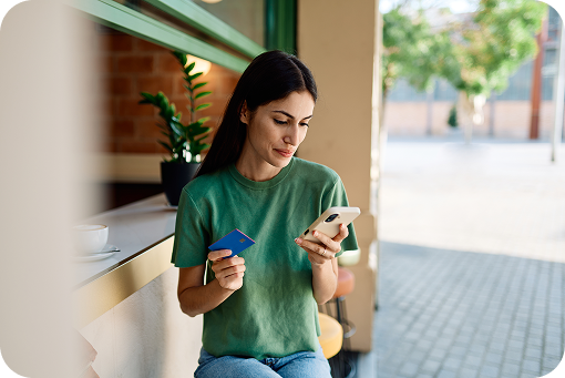 A person using a phone on a city street