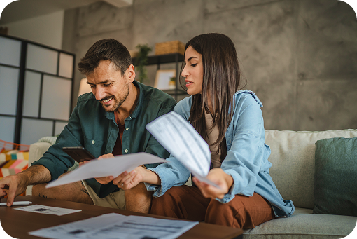A couple reviewing paperwork together at home