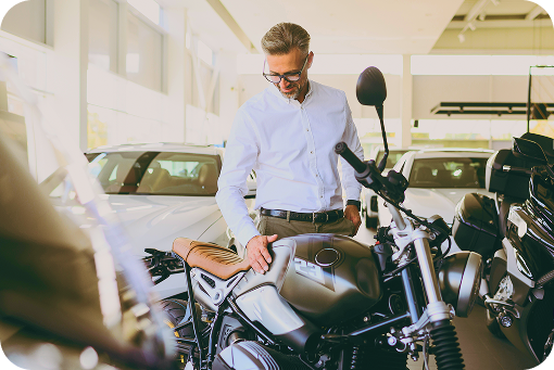 A person looking at motorcycles in a showroom