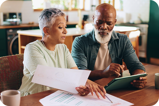 An older couple reviewing documents together at home
