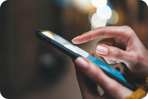 Close-up of a person tapping a smartphone screen